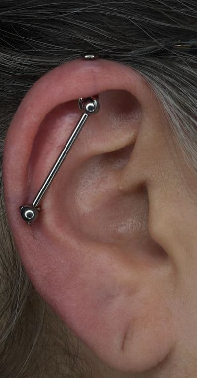 Piercing on the back by Noah at Platinum Tattoos & Piercings, San Antonio TX