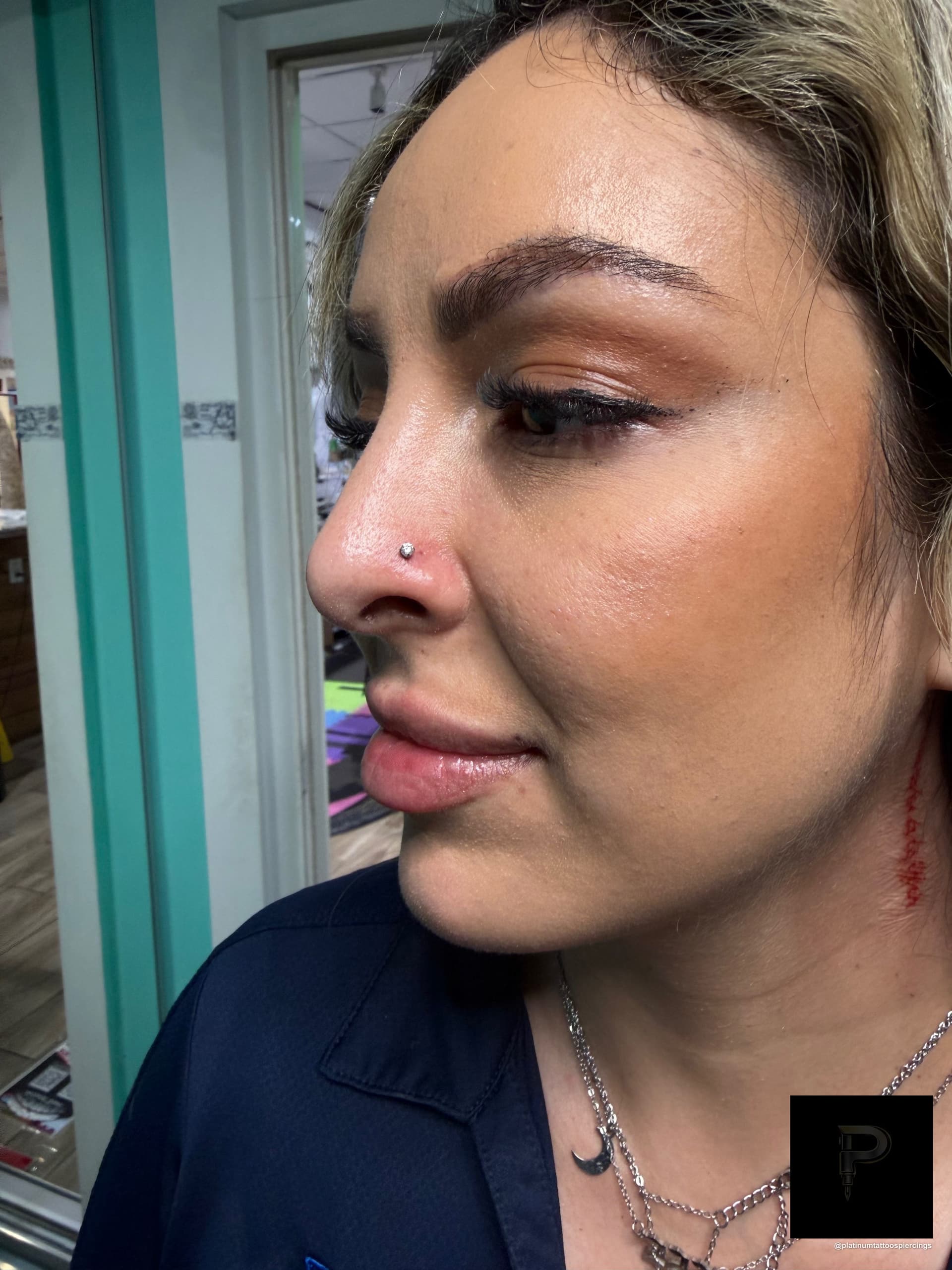Threadless piercing on the Nostril by Mingo at Platinum Tattoos & Piercings, San Antonio TX