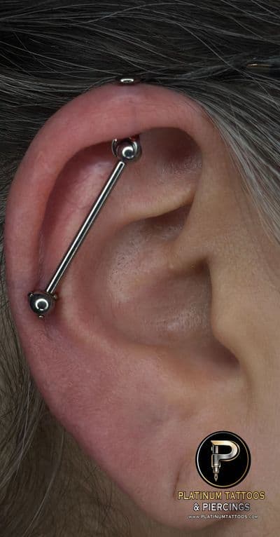 Piercing on the back by Noah at Platinum Tattoos & Piercings, San Antonio TX