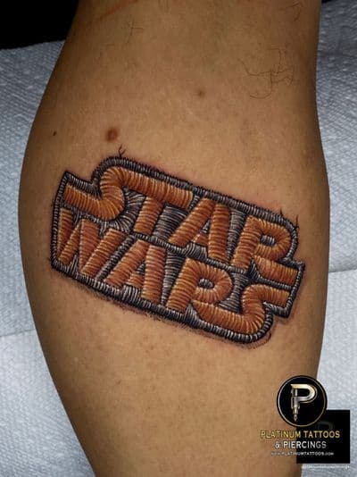 Patchwork tattoo on the calf by Remy at Platinum Tattoos & Piercings, San Antonio TX