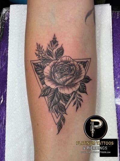 Floral tattoo on the forearm by JR at Platinum Tattoos & Piercings, San Antonio TX