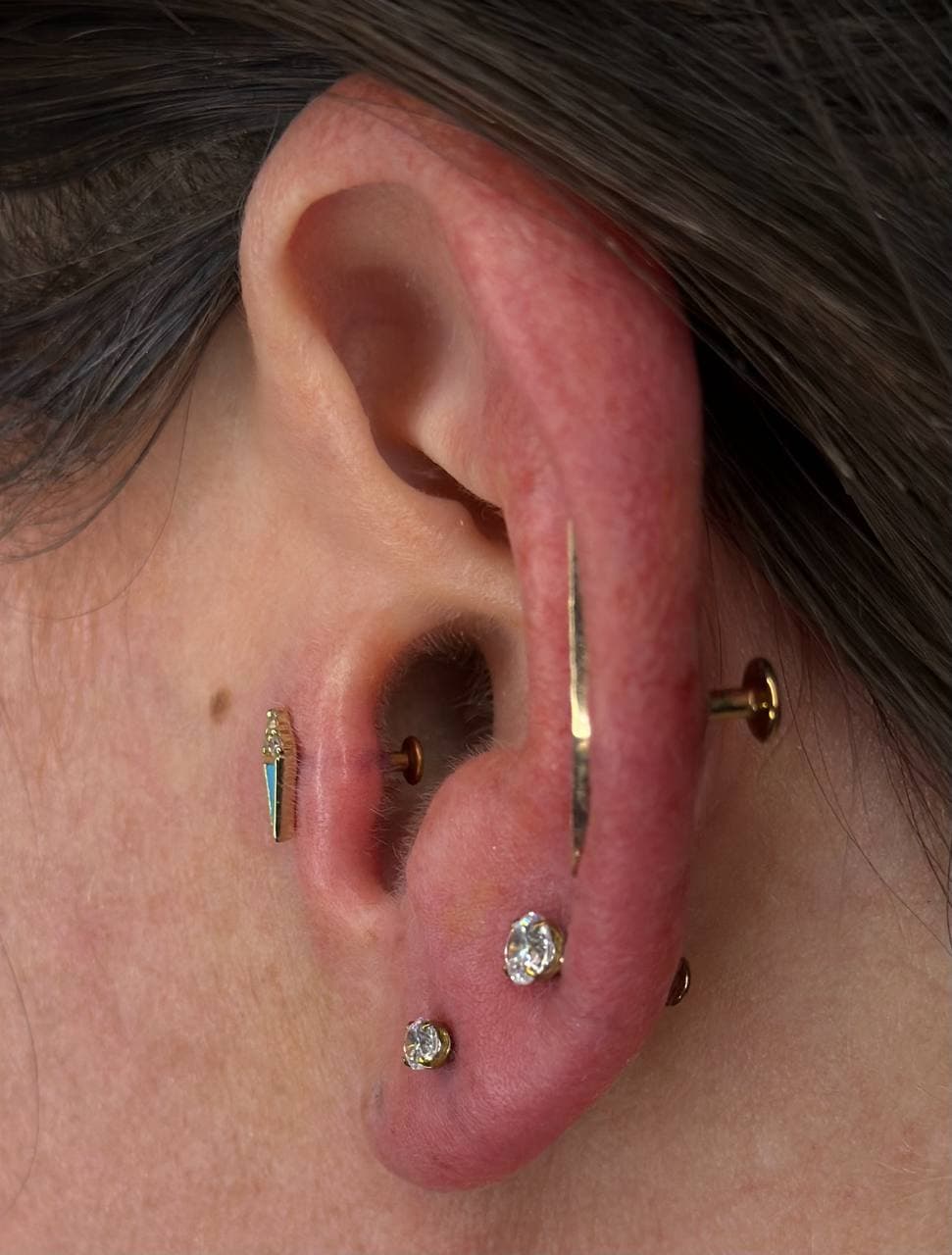 Curated healed ear with gold jewelry after downsizing — Platinum Tattoos & Piercings San Antonio