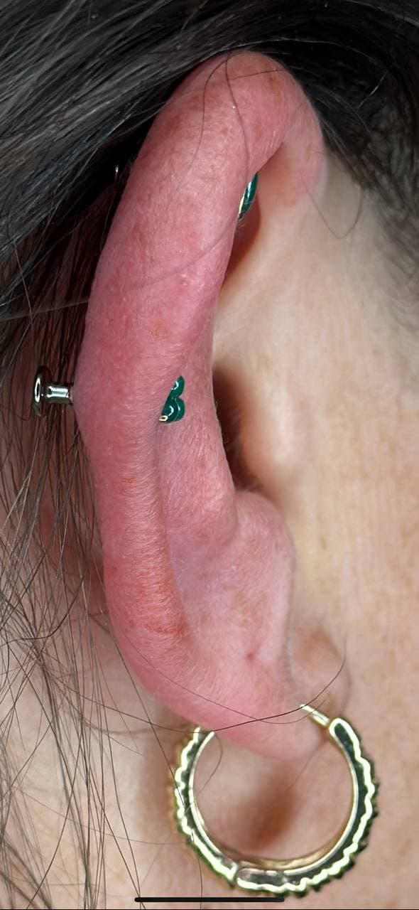 Curated ear with teal flatback gems after downsizing — Platinum Tattoos & Piercings San Antonio